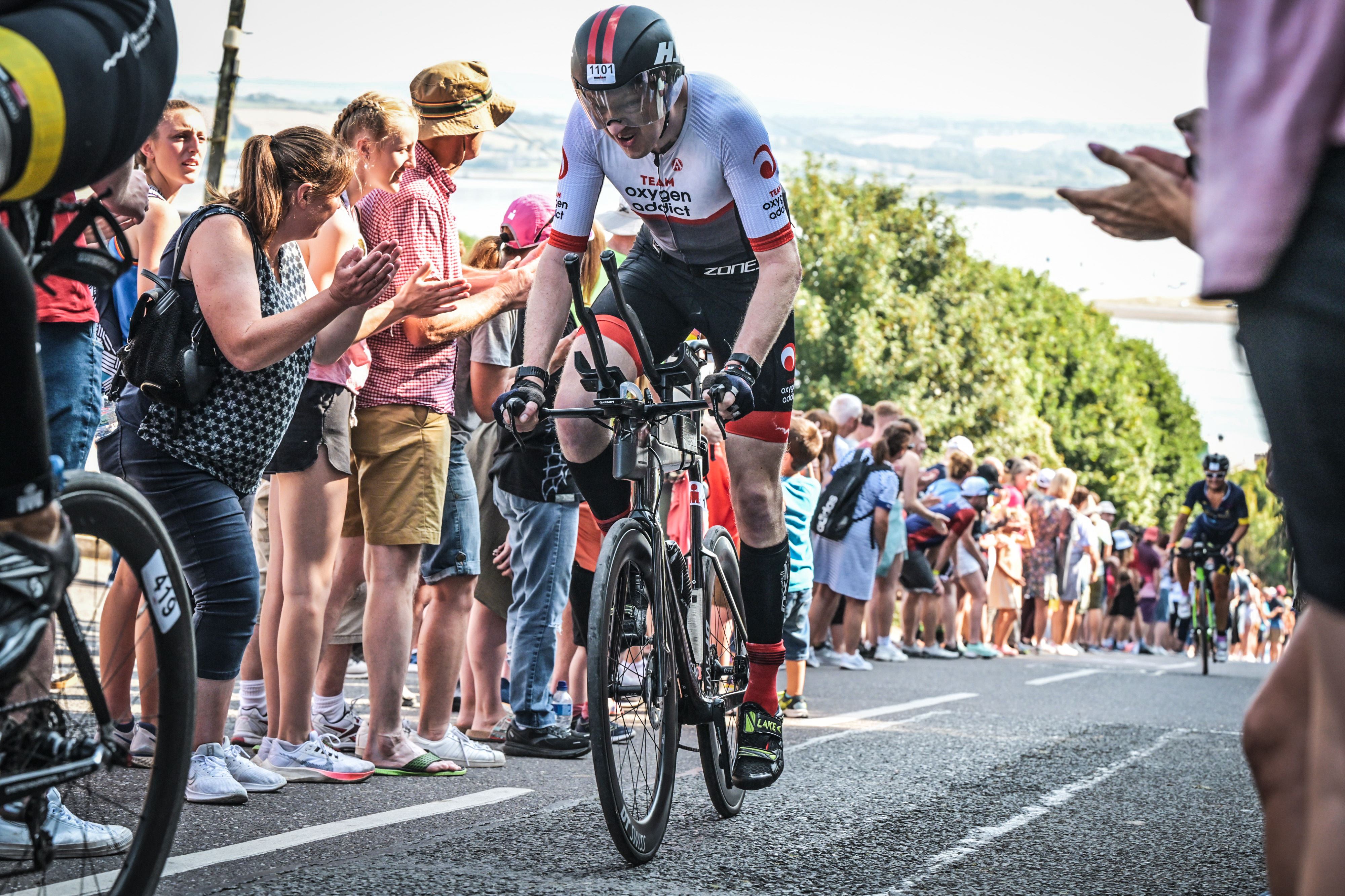 Climbing a steep hill on a bike in a race